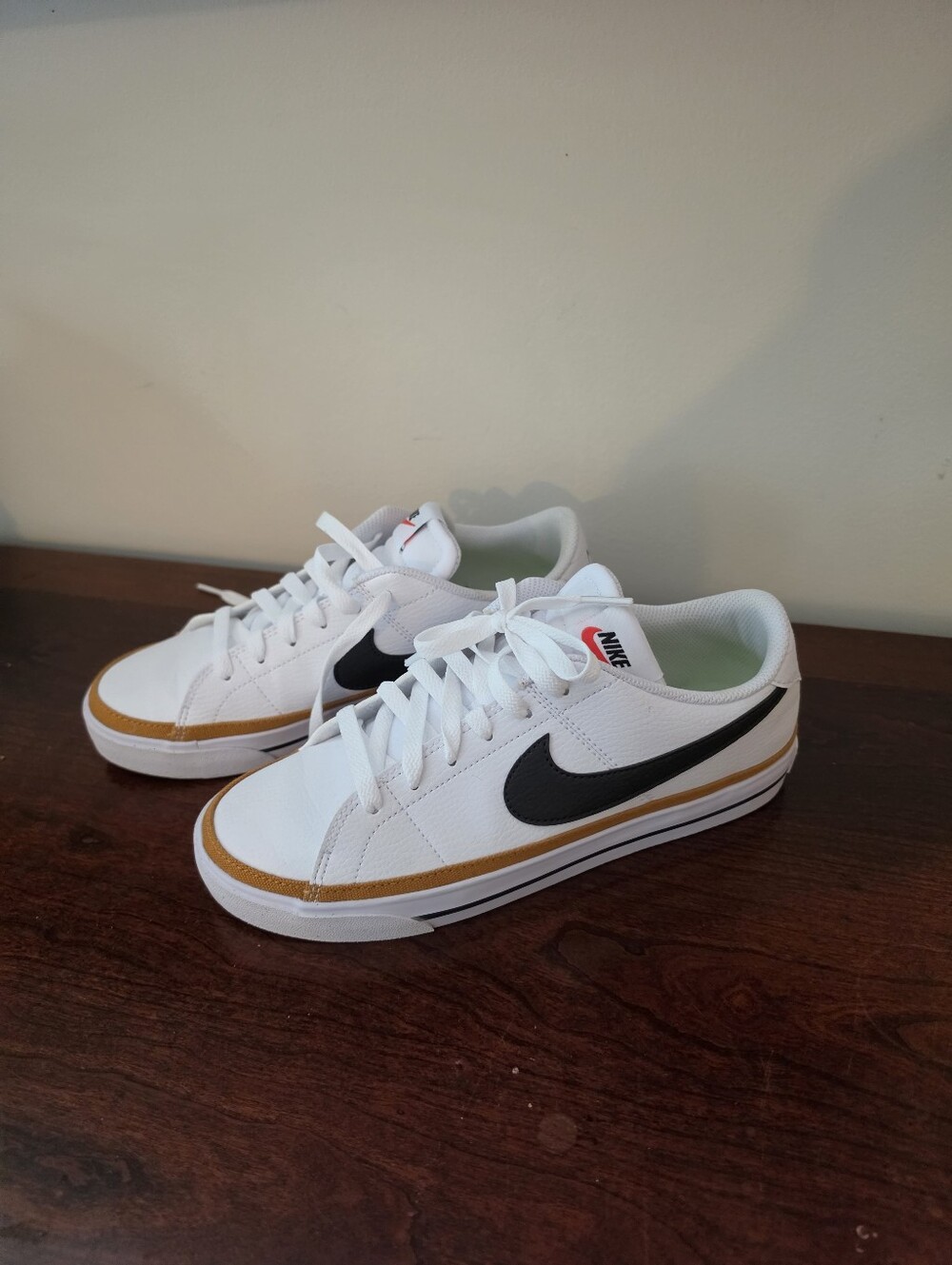Nike Womens White Low-Top Sneakers with Black Swoosh and Brown Trim